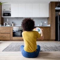 woman at home choosing a color to paint the walls - home decoration stock pictures, royalty-free photos & images