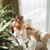 woman at home reading book and drinking coffee. - coffee stock pictures, royalty-free photos & images