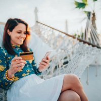 woman at summer vacation shopping online - travel stock pictures, royalty-free photos & images