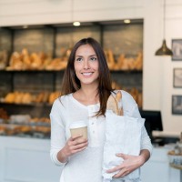woman buying bread at the bakery - junk food stock pictures, royalty-free photos & images