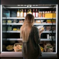 woman buying food at the supermarket - food stock pictures, royalty-free photos & images