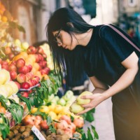 woman buying fruits on street market - food stock pictures, royalty-free photos & images