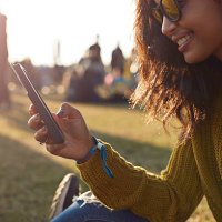 woman checking phone at festival - concert stock pictures, royalty-free photos & images