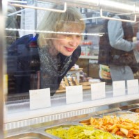 woman choosing ready to eat in supermarket - take out food in cafeteria - junk food stock pictures, royalty-free photos & images