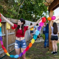 woman decorating the garden for a mexican party - garden decoration stock pictures, royalty-free photos & images