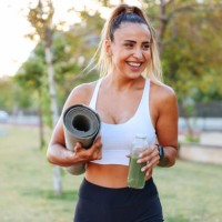 woman drinking vegetable smoothie after fitness running workout - junk food stock pictures, royalty-free photos & images