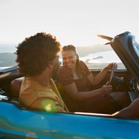 woman driving by boyfriend sitting in car - travel stock pictures, royalty-free photos & images