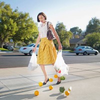 woman dropping groceries on sidewalk - food stock pictures, royalty-free photos & images