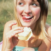 woman eating a cake - food stock pictures, royalty-free photos & images