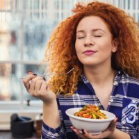 woman eating a healthy vegetarian meal - food stock pictures, royalty-free photos & images