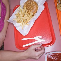 woman eating fast food - junk food stock pictures, royalty-free photos & images