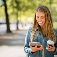 woman enjoying her coffee break at the park - junk food stock pictures, royalty-free photos & images