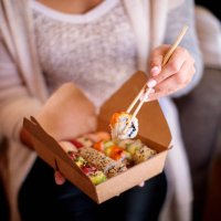 woman enjoying takeaway food at home - junk food stock pictures, royalty-free photos & images