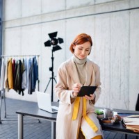 woman entrepreneur designer with tablet, working. - fashion stock pictures, royalty-free photos & images