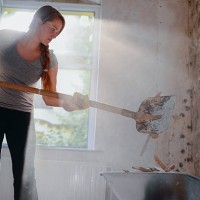 woman filling a wheelbarrow. - home decoration stock pictures, royalty-free photos & images