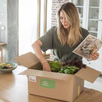 woman got package from meal delivery service. - food stock pictures, royalty-free photos & images