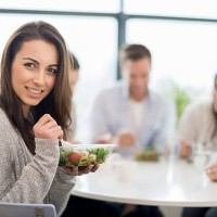 woman having dinner with friends - junk food stock pictures, royalty-free photos & images