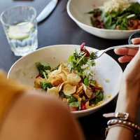 woman having food at restaurant table - food stock pictures, royalty-free photos & images