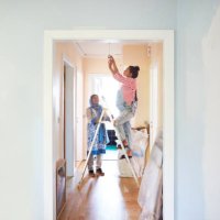 woman helping daughter-in-law in home renovation - home decoration stock pictures, royalty-free photos & images