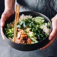 woman holding a poke salad bowl with chopsticks - food stock pictures, royalty-free photos & images