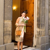 woman holding bouquet in doorway, florence, italy - fashion stock pictures, royalty-free photos & images