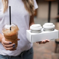 woman holding plastic glass of iced coffee - junk food stock pictures, royalty-free photos & images