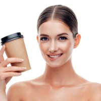 woman holds cup of coffee - junk food stock pictures, royalty-free photos & images