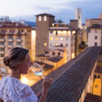 woman in beautiful white dress enjoying a glass of wine with the view of florence - travel stock pictures, royalty-free photos & images