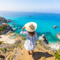 woman in capo vaticano, above the beaches of praia i focu, calabria, italy. - travel stock pictures, royalty-free photos & images