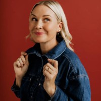 woman in denim jacket and pants on red background in studio - fashion stock pictures, royalty-free photos & images