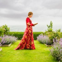 woman in medieval costume reading book in garden - garden decoration stock pictures, royalty-free photos & images