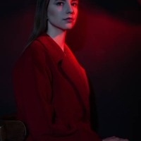 woman in stylish coat in dark studio - fashion stock pictures, royalty-free photos & images
