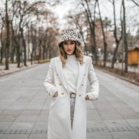 woman in white wardrobe walking through the park - fashion stock pictures, royalty-free photos & images