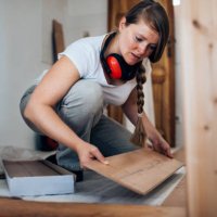 woman installing laminate flooring. - home decoration stock pictures, royalty-free photos & images