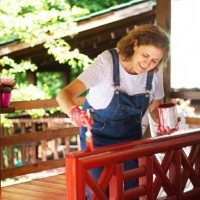 woman is coloring the fence at home - garden decoration stock pictures, royalty-free photos & images
