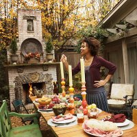 woman lighting candles on table - garden decoration stock pictures, royalty-free photos & images