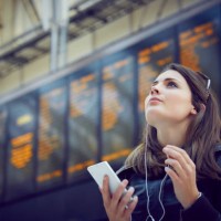 woman looking at departure information, london, uk - travel stock pictures, royalty-free photos & images