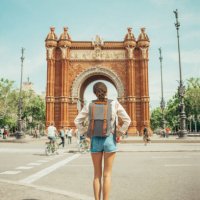 woman looking at triumphal arch in barcelona - travel stock pictures, royalty-free photos & images