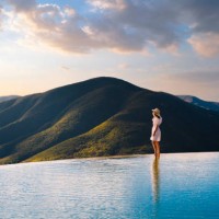 woman looking at view at hierve el agua, oaxaca, mexico - travel stock-fotos und bilder