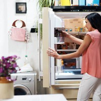 woman looking in the fridge - food stock pictures, royalty-free photos & images