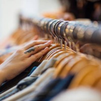 woman looking through clothing - fashion stock pictures, royalty-free photos & images