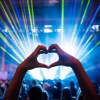 woman making heart shape with hands at music event - concert stock pictures, royalty-free photos & images