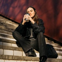 woman on a public park with a coffee mug - junk food stock pictures, royalty-free photos & images