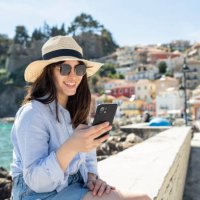 woman on a summer vacation using her phone. - travel stock pictures, royalty-free photos & images