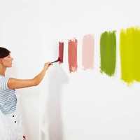 woman painting colour swatches on wall - home decoration stock pictures, royalty-free photos & images