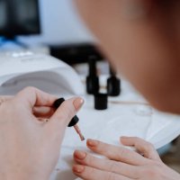 woman painting her nails at home during pandemic - nails art stock pictures, royalty-free photos & images