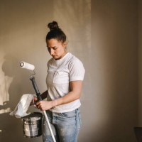 woman painting room - home decoration stock pictures, royalty-free photos & images