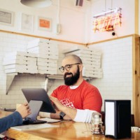 woman paying with credit card in pizzeria - junk food stock pictures, royalty-free photos & images