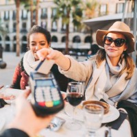 woman payng in restaurant - travel stock pictures, royalty-free photos & images