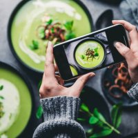 woman photographing fresh green soup - food stock pictures, royalty-free photos & images